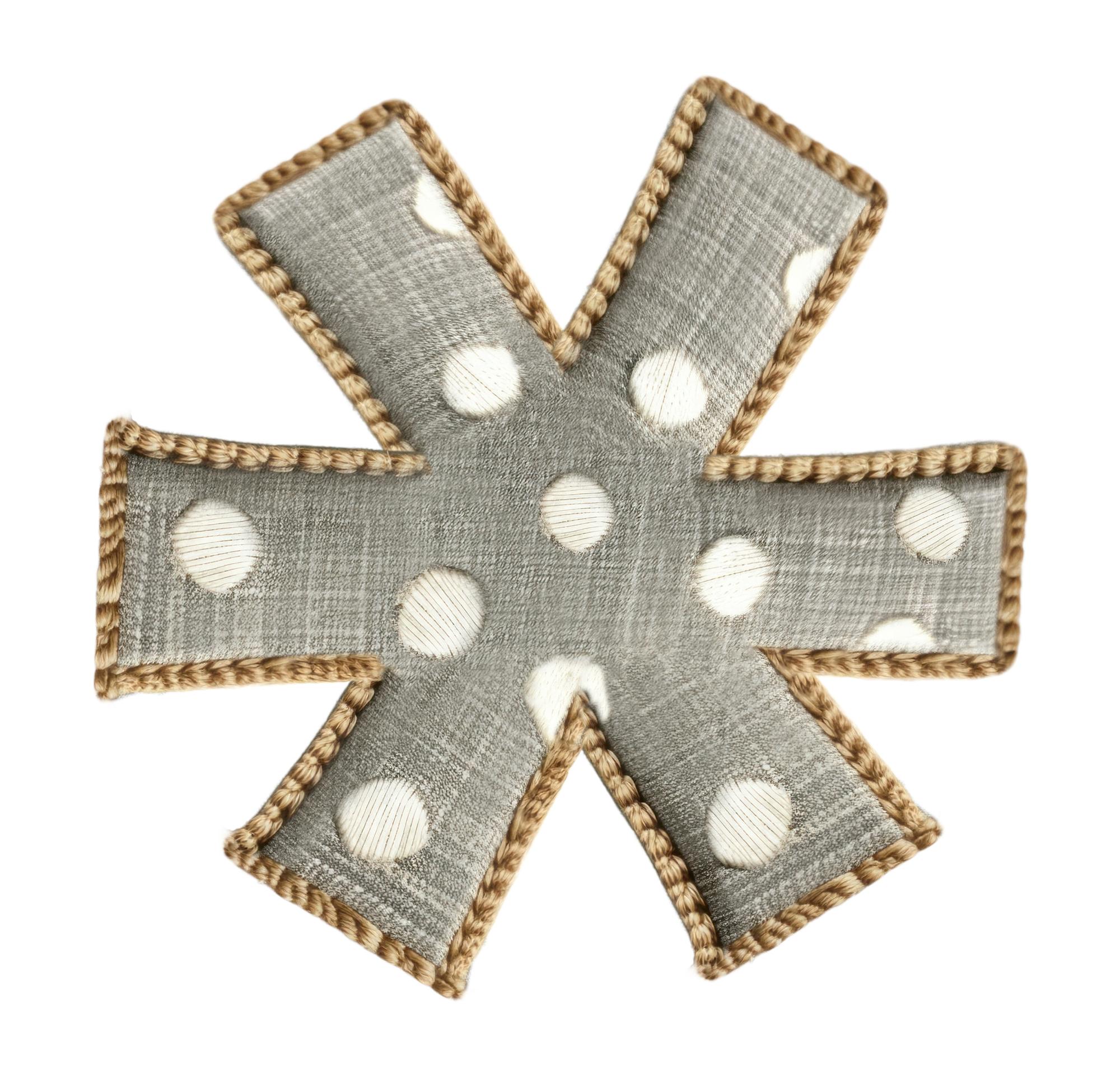 Series of embroidered patches on linen